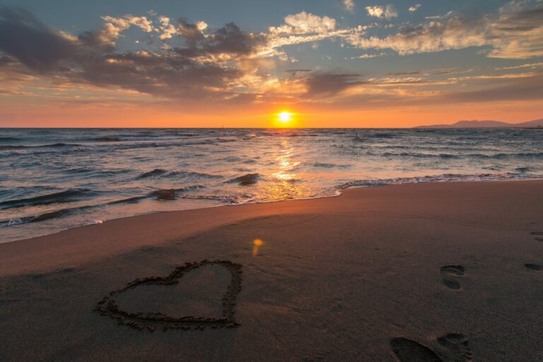 Heart Shape Drawn In The Sand On A Beach